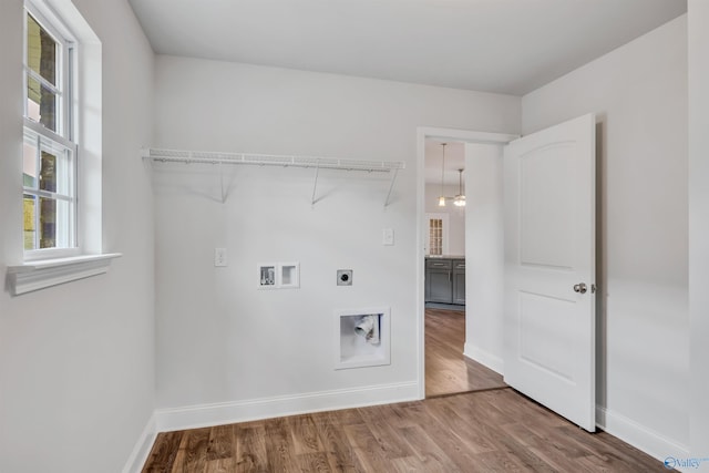 laundry room featuring laundry area, washer hookup, electric dryer hookup, and wood finished floors