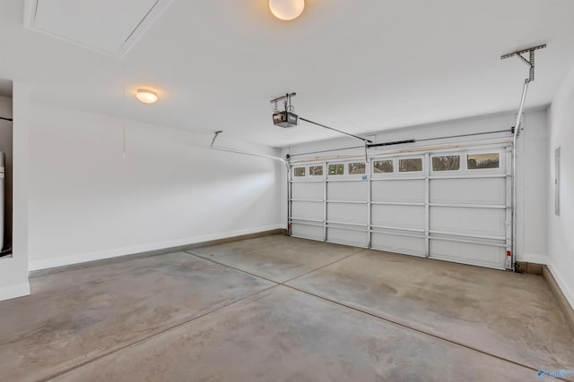 garage featuring baseboards and a garage door opener