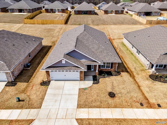 birds eye view of property with a residential view