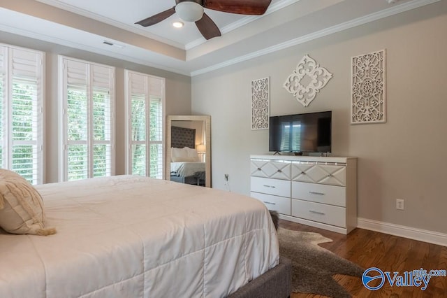 bedroom featuring multiple windows, wood-type flooring, and ceiling fan