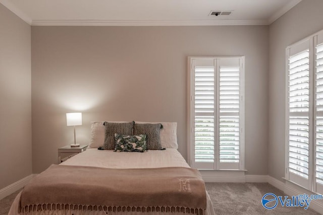 carpeted bedroom with crown molding