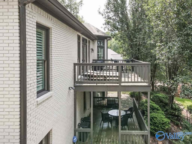 back of house with a wooden deck