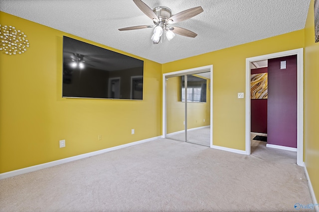 328 Shadow Pointe Dr SW, Decatur, AL 35601 - unfurnished bedroom with a textured ceiling, carpet flooring, and a ceiling fan
