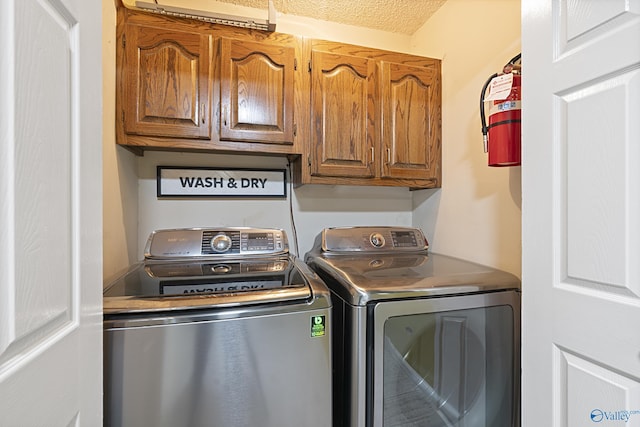 328 Shadow Pointe Dr SW, Decatur, AL 35601 - laundry room with cabinet space and washing machine and dryer