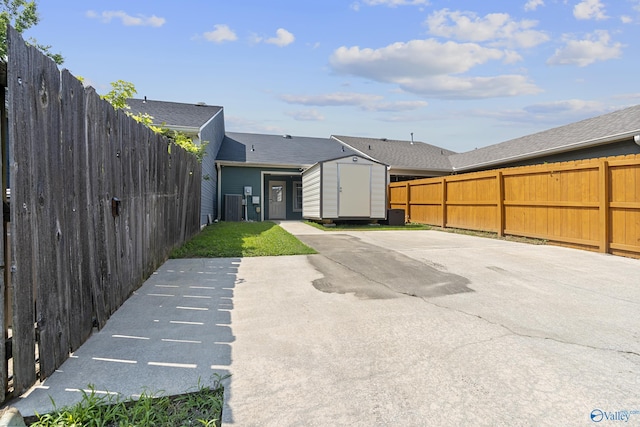 328 Shadow Pointe Dr SW, Decatur, AL 35601 - view of vehicle parking with a storage unit and a fenced backyard