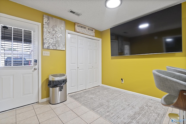 328 Shadow Pointe Dr SW, Decatur, AL 35601 - tiled foyer entrance with baseboards and a textured ceiling