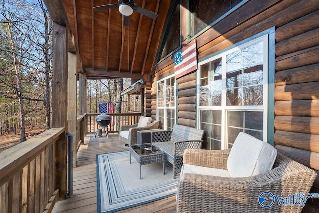 wooden terrace with ceiling fan and grilling area