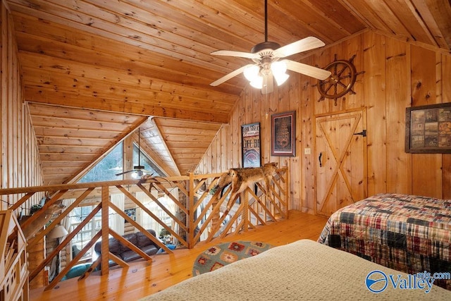 bedroom with lofted ceiling, wood-type flooring, and wooden ceiling