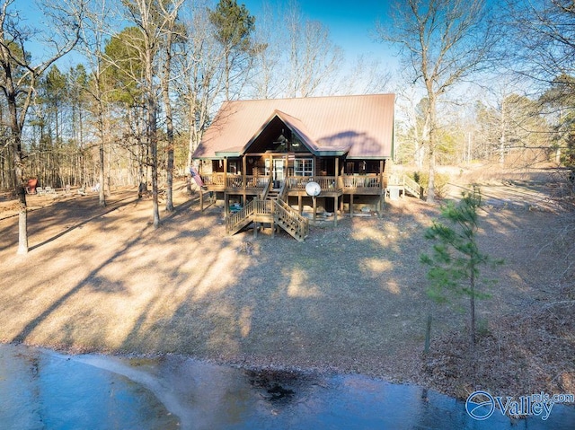 rear view of property with a porch