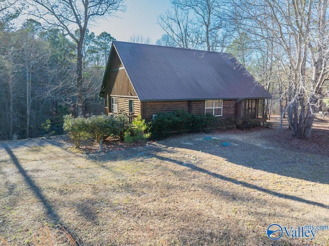 view of property exterior featuring a yard