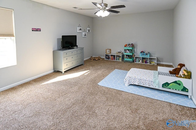 bedroom featuring ceiling fan, carpet, and baseboards