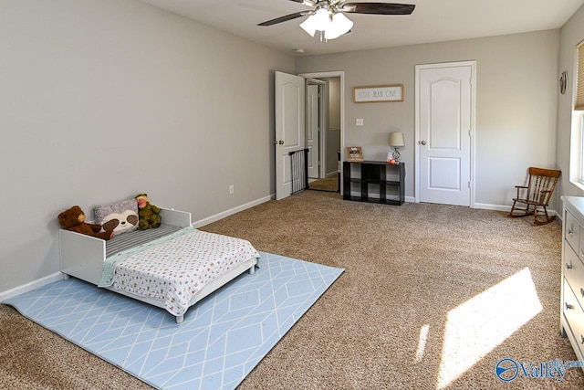 bedroom with carpet flooring, a ceiling fan, and baseboards