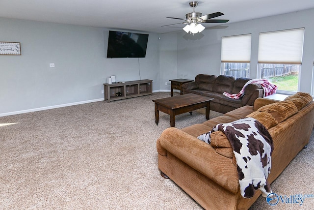 living room featuring carpet flooring and baseboards