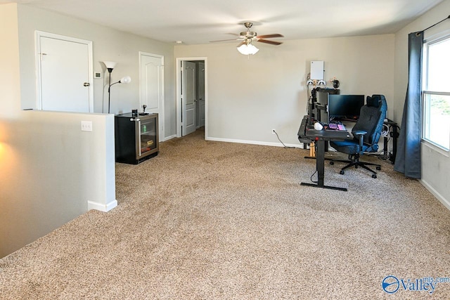 dining area with light carpet, a ceiling fan, and baseboards