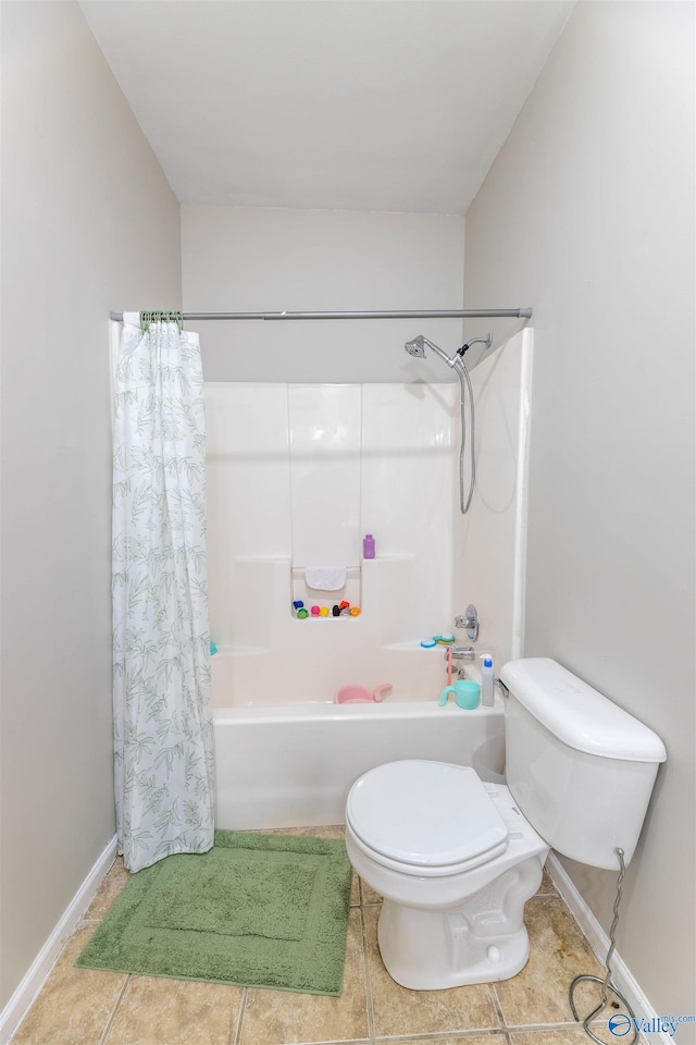 bathroom with tile patterned flooring, shower / bath combination with curtain, toilet, and baseboards