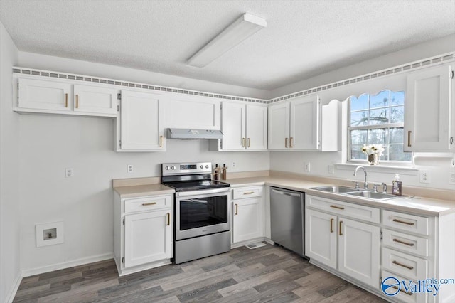 kitchen featuring white cabinetry, appliances with stainless steel finishes, dark hardwood / wood-style floors, and sink