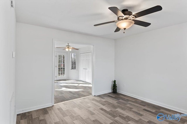 empty room featuring hardwood / wood-style flooring