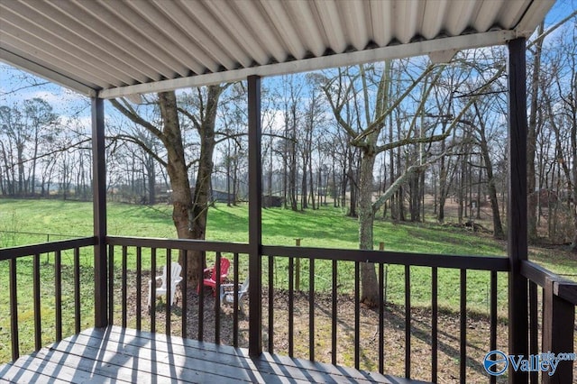 wooden terrace with a yard