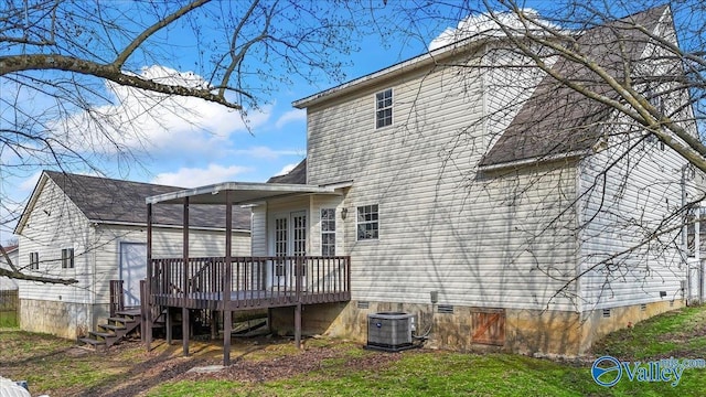 rear view of house with central AC unit and a deck