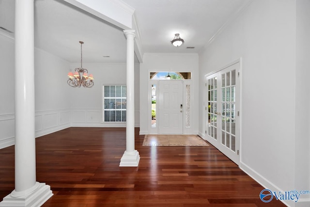 119 Cannes Dr, Brownsboro, AL 35741 - foyer featuring ornate columns, wood finished floors, ornamental molding, and a chandelier