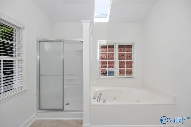 119 Cannes Dr, Brownsboro, AL 35741 - full bathroom featuring a stall shower, a jetted tub, and a skylight