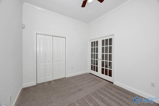 119 Cannes Dr, Brownsboro, AL 35741 - unfurnished bedroom with french doors, crown molding, carpet flooring, a closet, and a ceiling fan