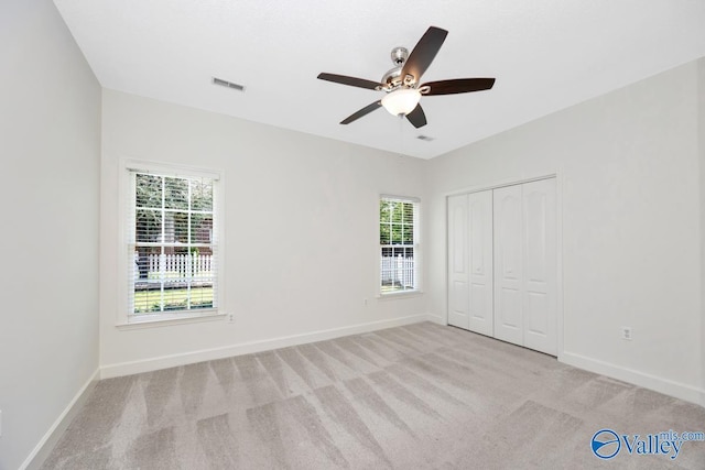 119 Cannes Dr, Brownsboro, AL 35741 - unfurnished bedroom featuring carpet, a closet, and a ceiling fan
