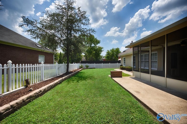 119 Cannes Dr, Brownsboro, AL 35741 - fenced backyard featuring a patio and a sunroom