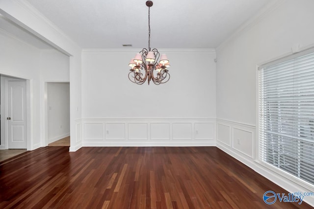 119 Cannes Dr, Brownsboro, AL 35741 - spare room featuring a chandelier, dark wood-style flooring, crown molding, and a wainscoted wall