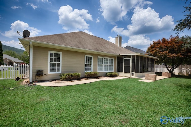 119 Cannes Dr, Brownsboro, AL 35741 - back of house featuring a sunroom, a chimney, a fenced backyard, and a shingled roof