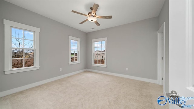 unfurnished bedroom featuring light colored carpet and ceiling fan