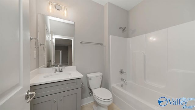 full bathroom featuring tile patterned floors,  shower combination, toilet, and vanity