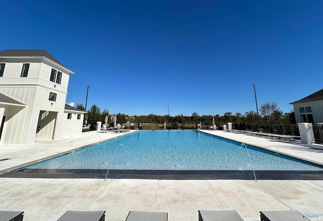 view of swimming pool with a patio