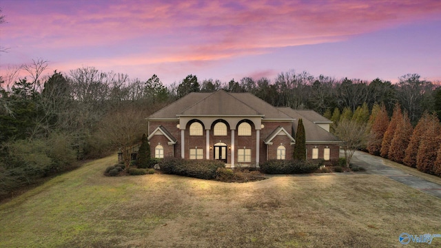 view of front of house with a yard