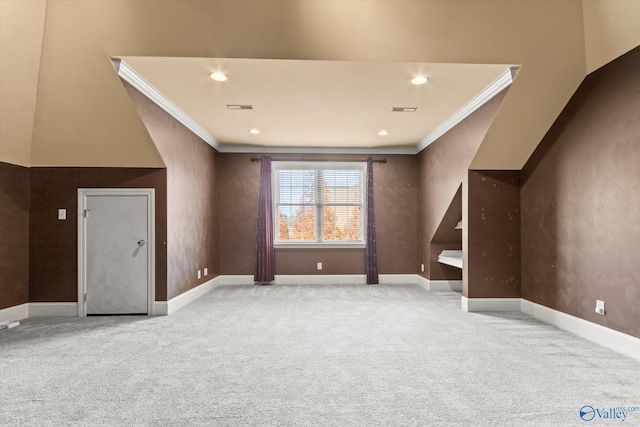 bonus room with light colored carpet