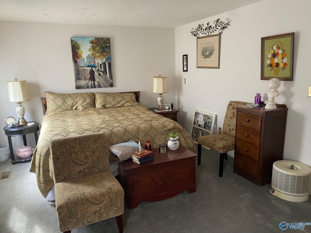 bedroom featuring carpet floors and a textured ceiling
