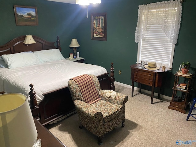 bedroom with carpet and baseboards