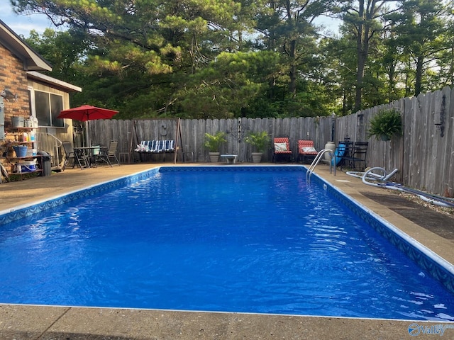 view of pool with a fenced in pool and a fenced backyard