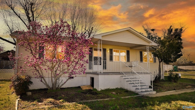 view of front of home featuring a porch and stairs