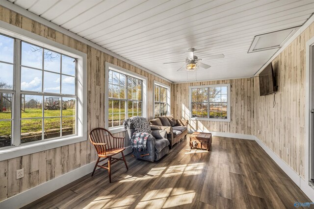 sunroom featuring ceiling fan