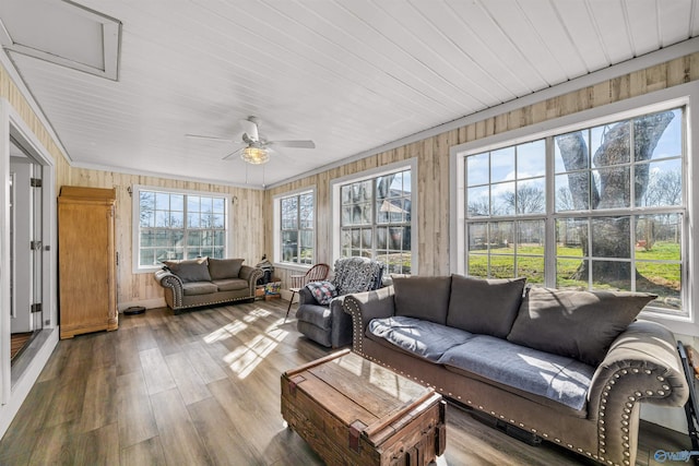 sunroom / solarium with a ceiling fan