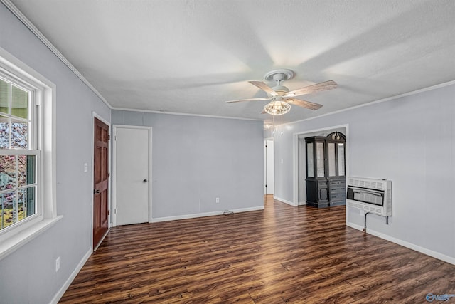 unfurnished room featuring heating unit, dark wood-style floors, and ornamental molding