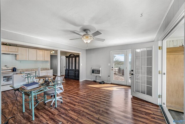 office featuring heating unit, a ceiling fan, baseboards, dark wood-type flooring, and french doors