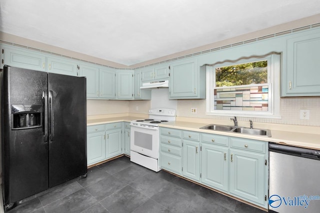 kitchen featuring sink, black fridge, stainless steel dishwasher, white range with electric stovetop, and backsplash