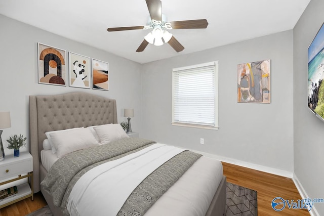 bedroom featuring hardwood / wood-style flooring and ceiling fan