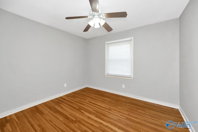 empty room featuring ceiling fan and wood-type flooring