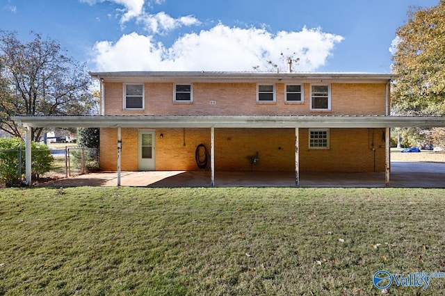 rear view of house with a yard