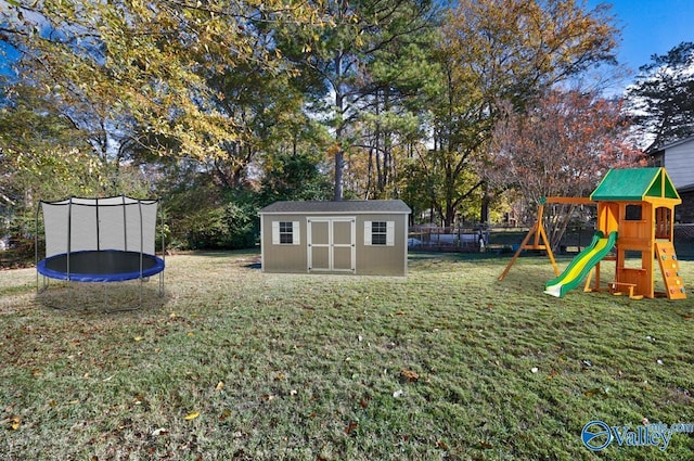 view of yard with a playground, a storage unit, and a trampoline