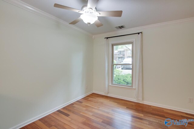 unfurnished room featuring ornamental molding, a healthy amount of sunlight, ceiling fan, and light hardwood / wood-style flooring