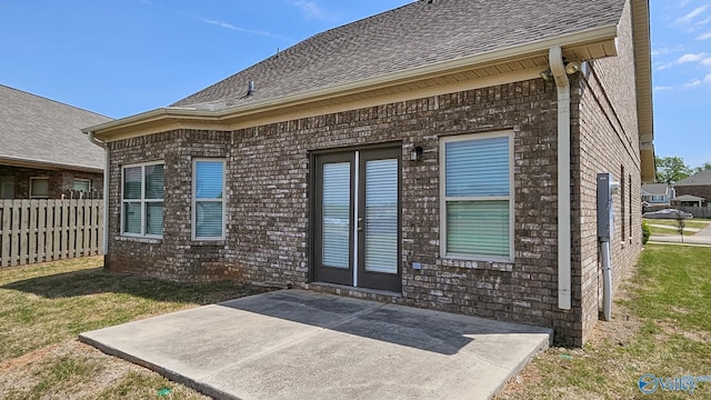 7607 NW Ashor Dr, Huntsville, AL 35806 - entrance to property with a patio area, a shingled roof, and brick siding